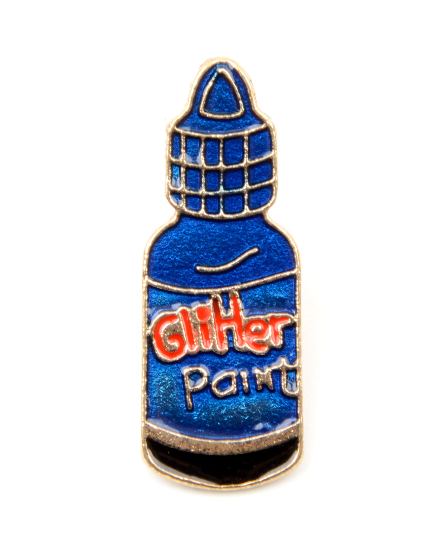 Glitter festék formájú, pin jellegű kitűző.
