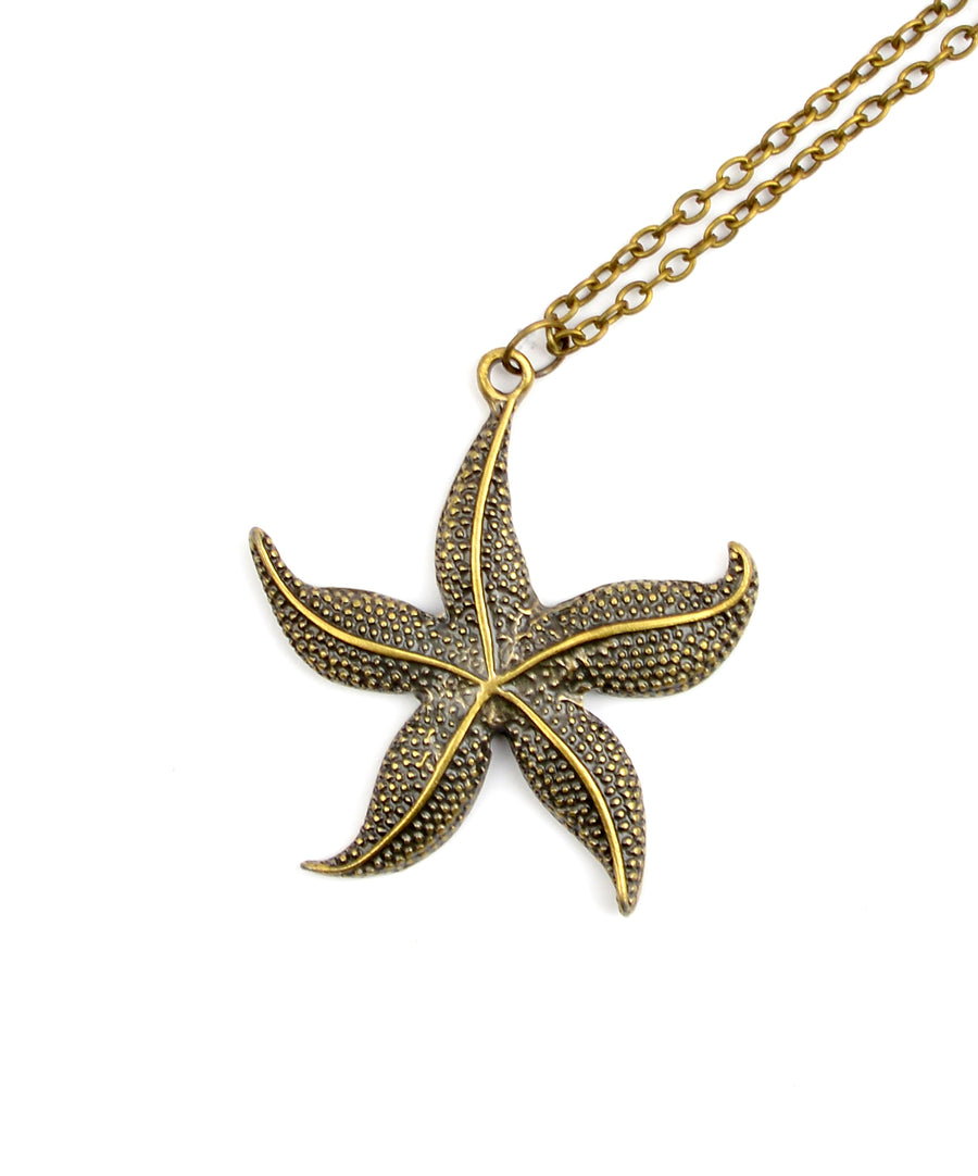 Filigrán réz nyaklánc tengeri csillag alakú medállal.